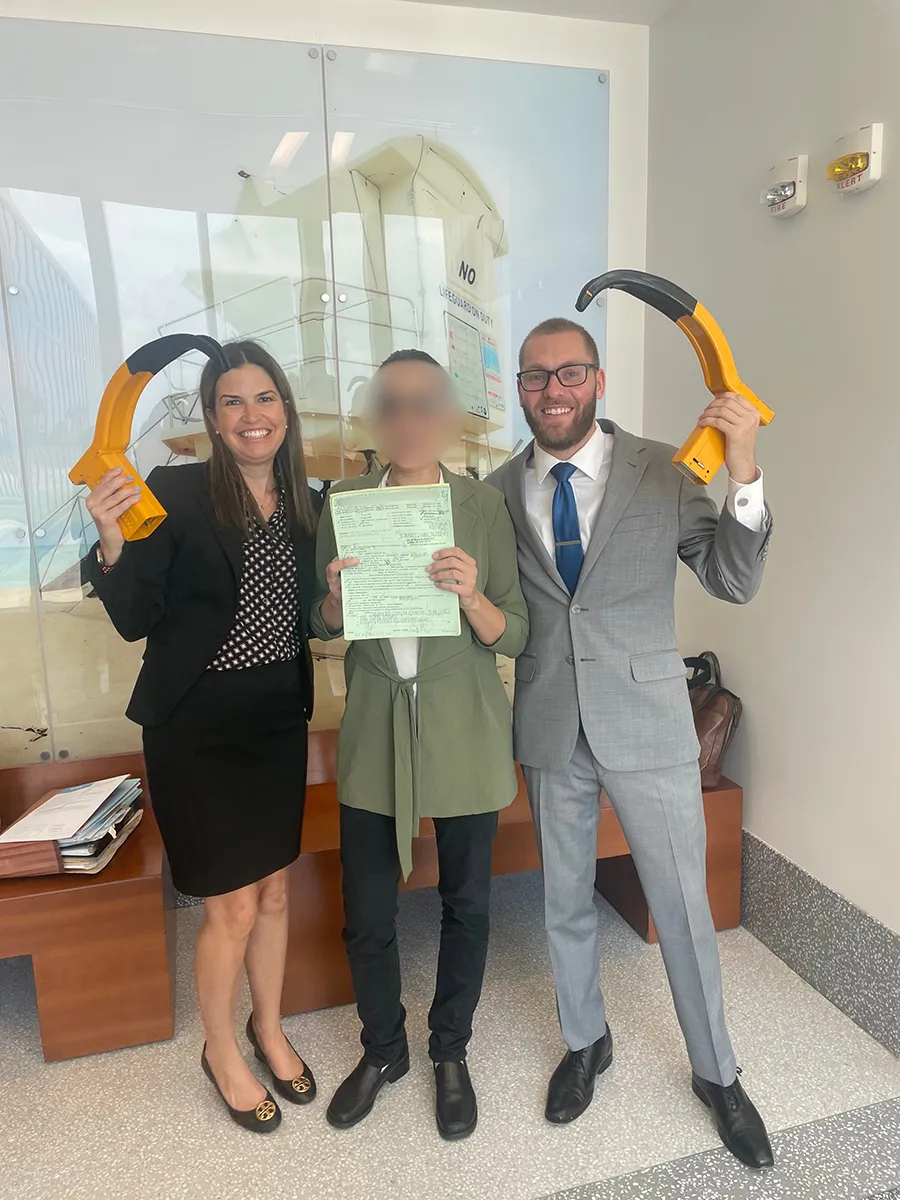 A team standing together with a man in the middle.